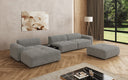 Designer-Ecksofa Calm mat Bäihocker a Bäidësch a Bouclé