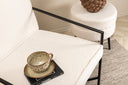 Fauteuil design Lundra – Chaise rembourrée en blanc cassé avec structure métallique noire