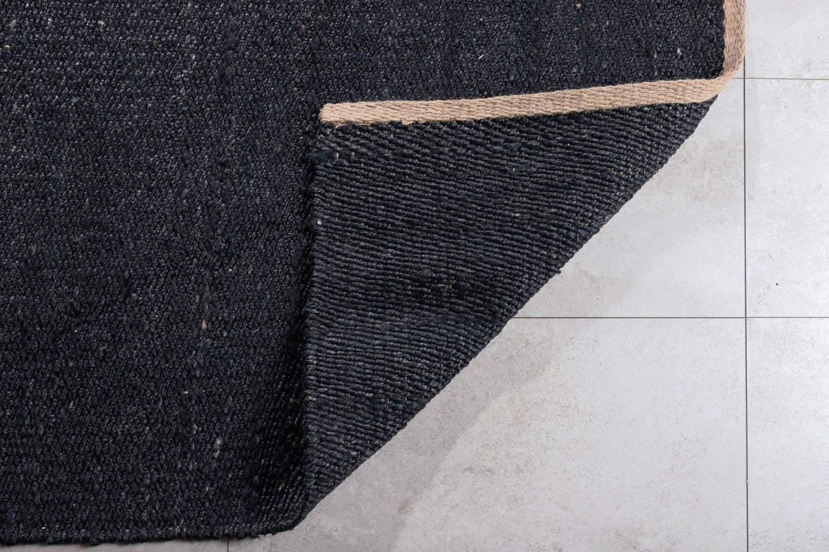 Carpet Malik – handwoven in Black from jute