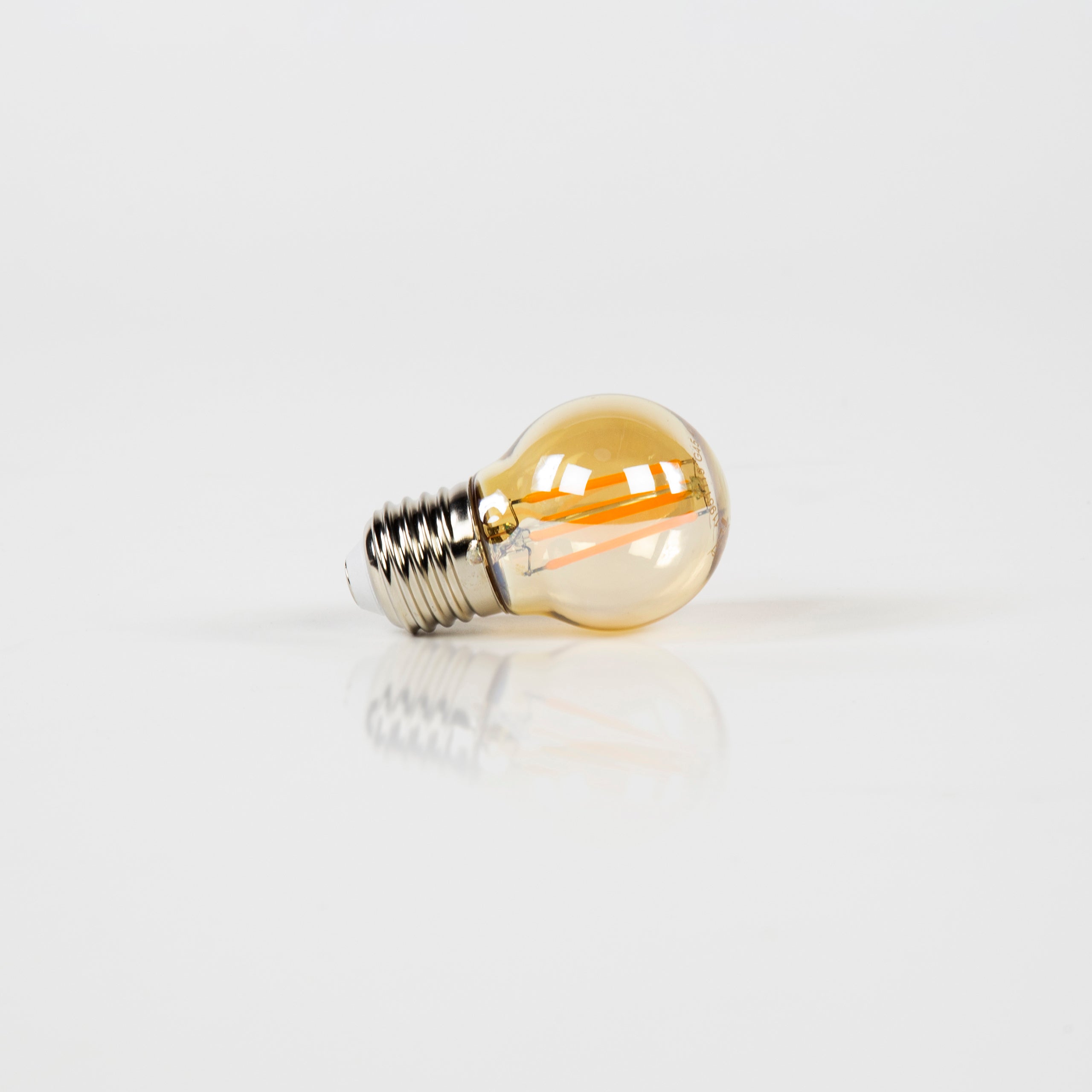LED incandescent bulb Embera – G45-E27 with amber-colored glass
