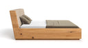 Designer Holzbett Cassian aus massiver Eech mat Stauraum
