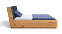 Designer Holzbett Cassian aus massiver Eech mat Stauraum