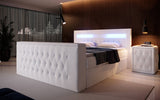 Boxspringbett Menzogna mit TV Lift, USB und Stauraum (2 Schubladen) - Luxusbetten24