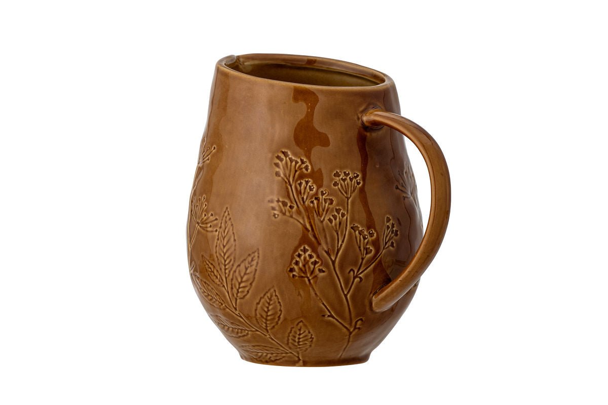 Cruche Fiora – grès avec motif floral en relief dans une teinte chaude